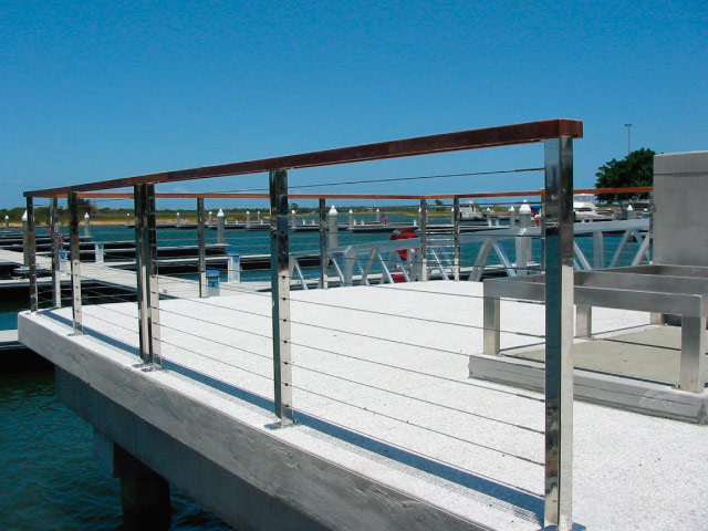 Steel post run with intermediate posts and stainless steel cabling components.